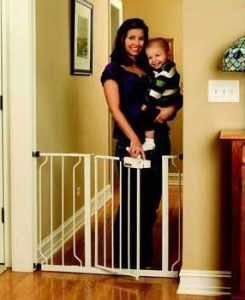 Best pressure gates: Regalo Easy Step Walk Thru Gate with mother walking through holding baby